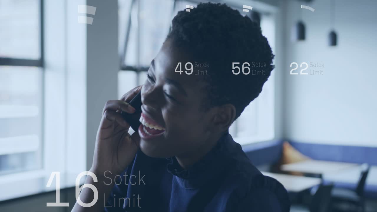 Business woman taking call, holding phone, laughing after hearing good news while HUD updating