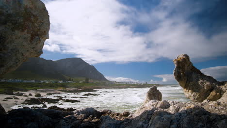 Picturesque-seaside-town-of-Hermanus-nestled-between-ocean-and-mountains