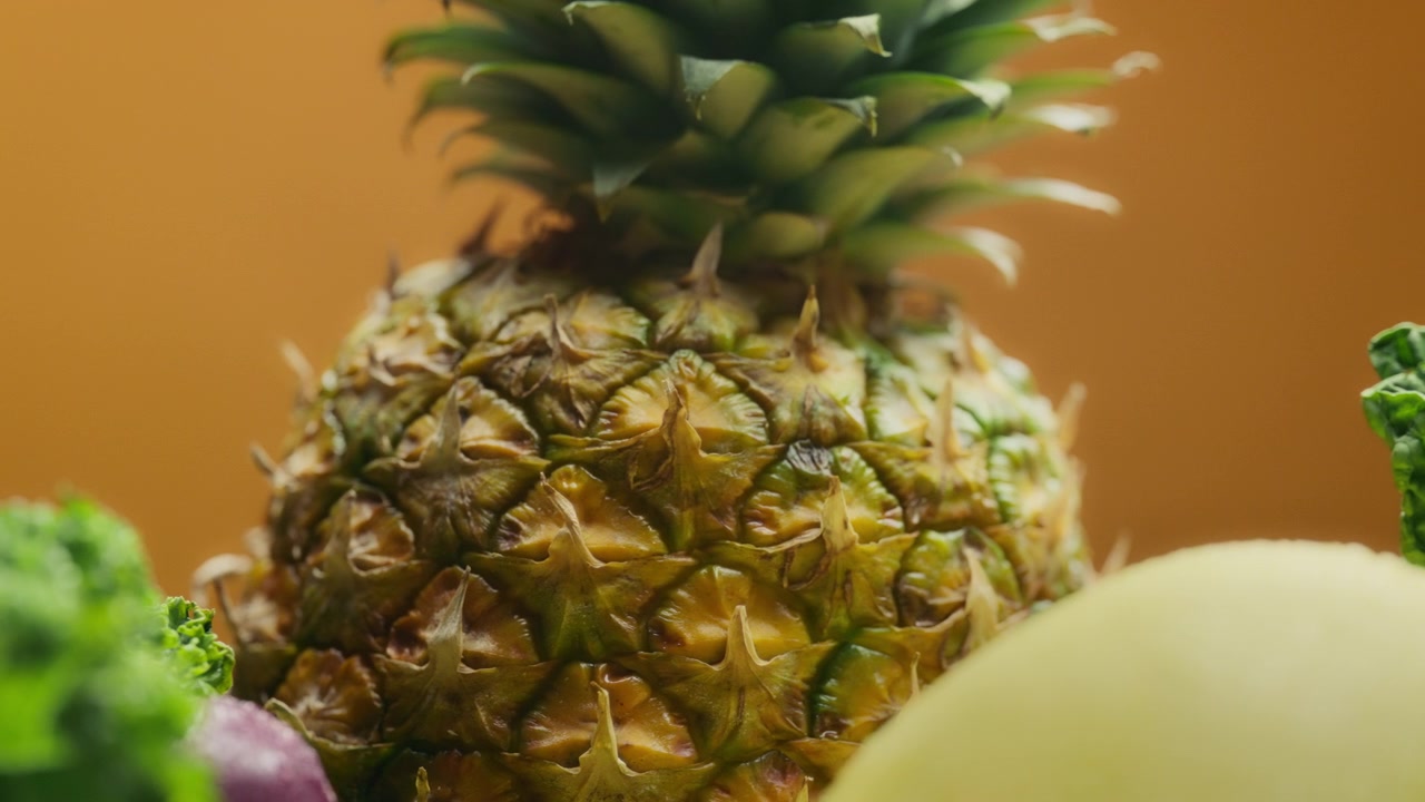 Close up of pineapple between fruits and vegetables