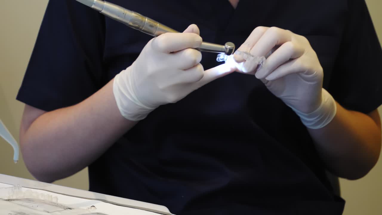 Dentist working with invisible braces