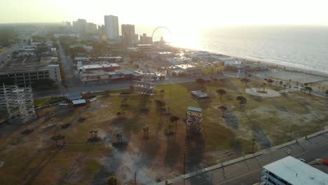 Aerial-Parallax-Shot-of-Park-at-Myrtle-Beach-during-Golden-Hour