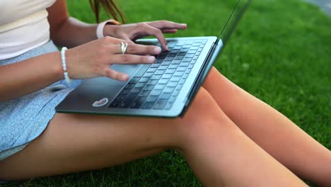 woman working on laptop outdoors