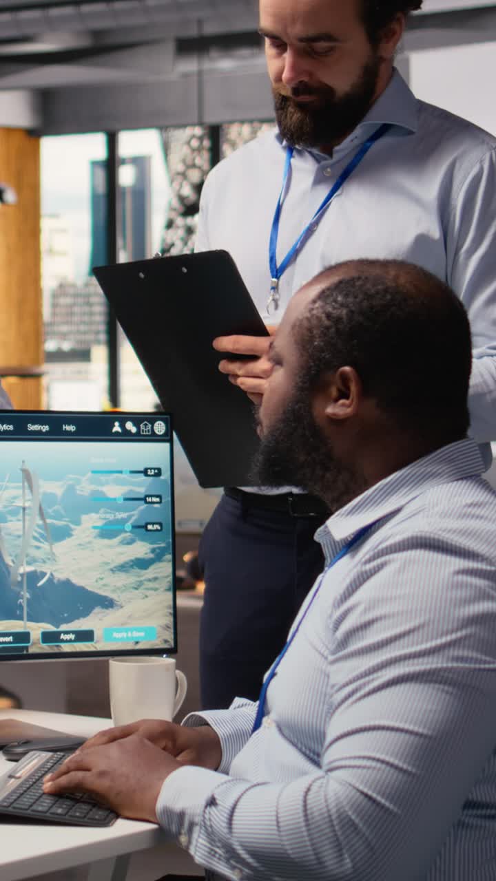 Team of engineers brainstorming how to optimize electric grid and wind farm