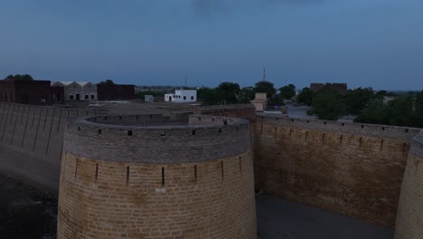 aerial of umerkot fort landmark in sindh, pakistan after sunset