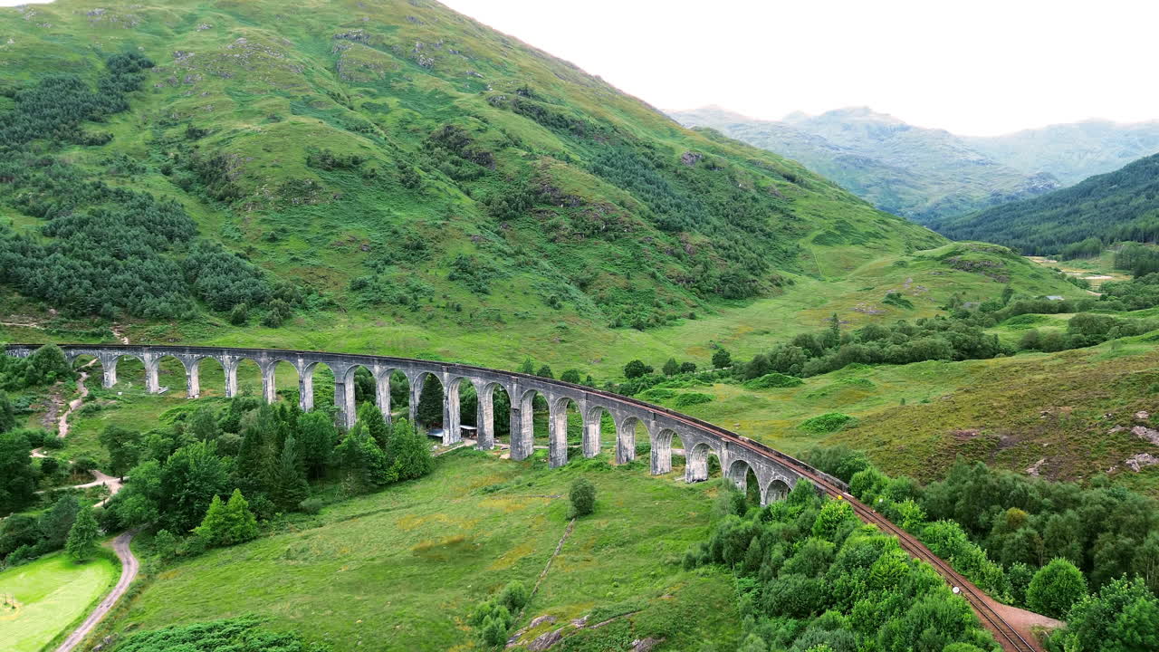 Establishing drone shot of Glenfinnan Viaduct during the day at Glenfinnan, in the Lochaber district of north-western Scotland, UK