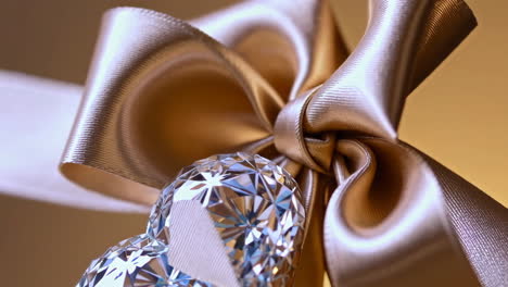 elegant golden bow with sparkling crystal heart