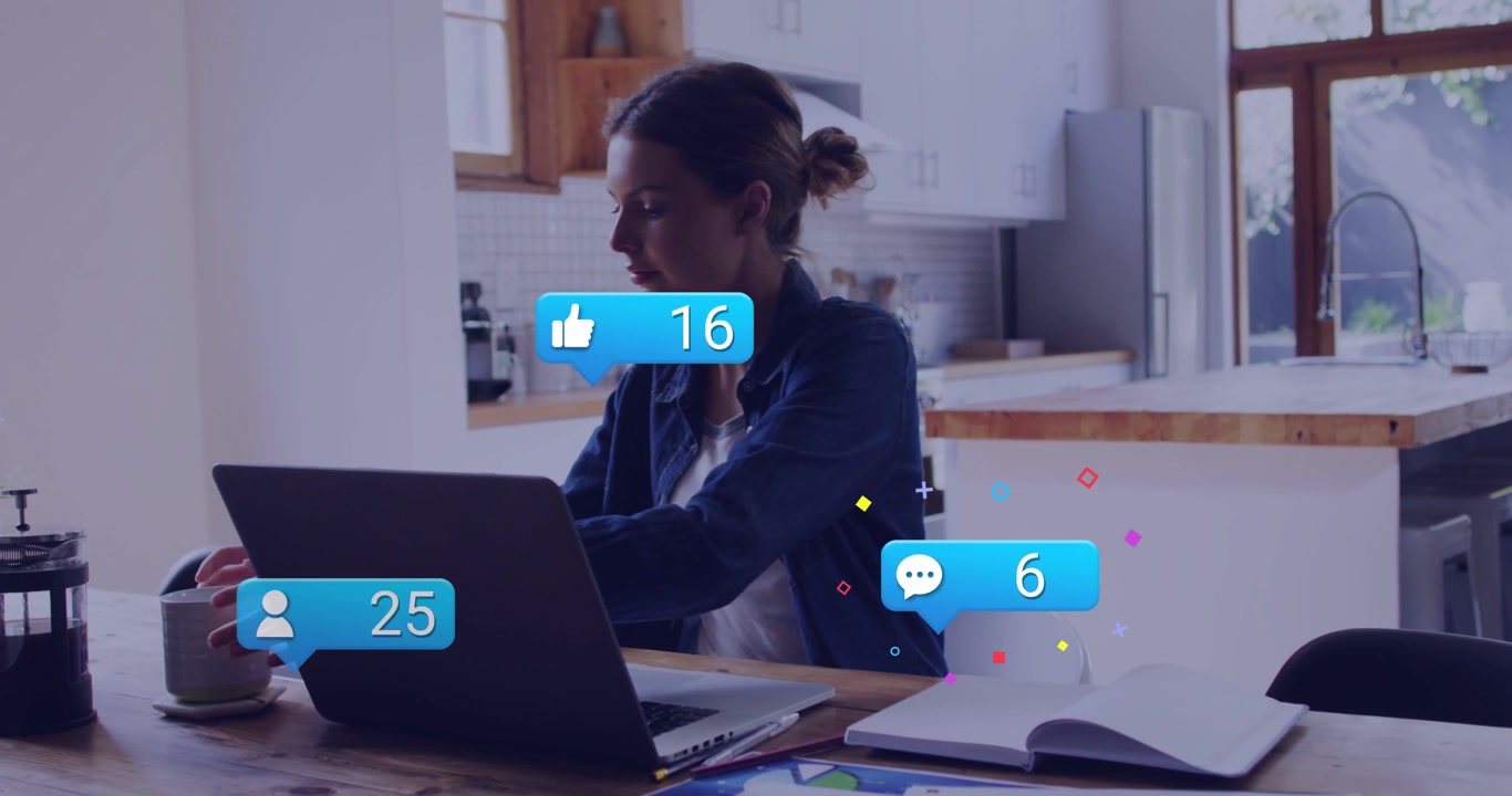 Woman working at home table reaching for paper by laptop causing blue bubble, tracking social stats