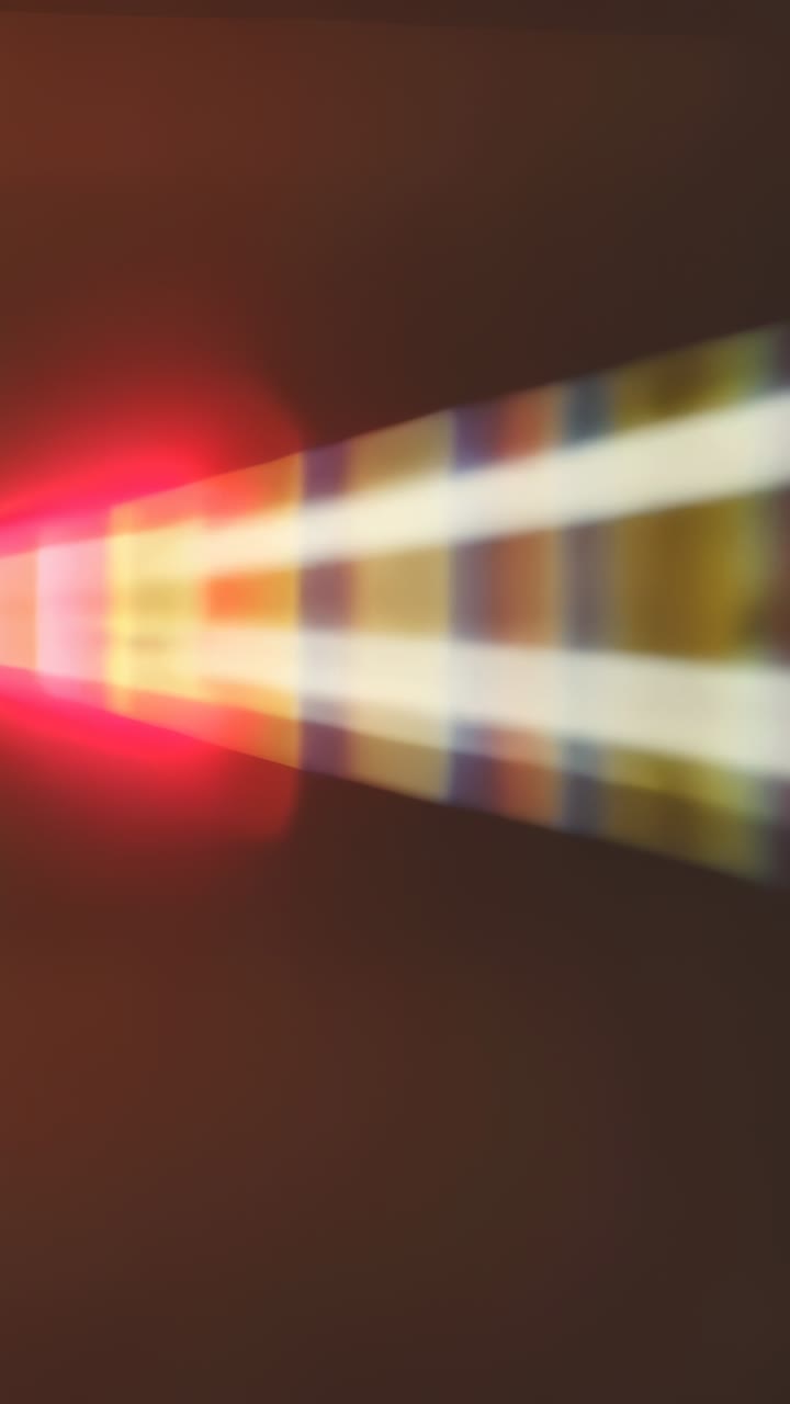 Vertical video: Flaring apex driving triangle beam sliding wall with white stripe, bands, red glows