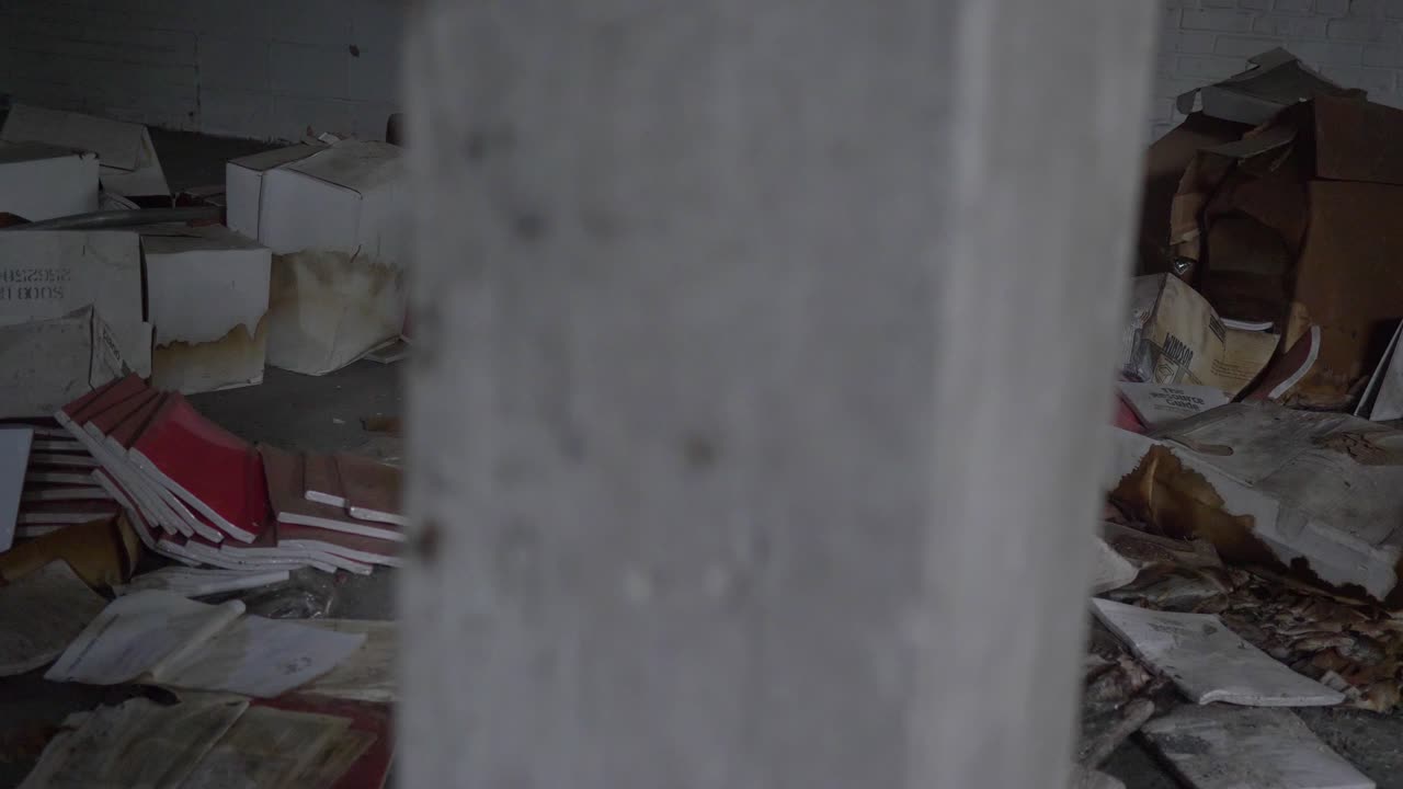 Abandoned Building with Damaged Tiles and Debris