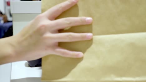 mobile payment at a retail store and brown paper bag