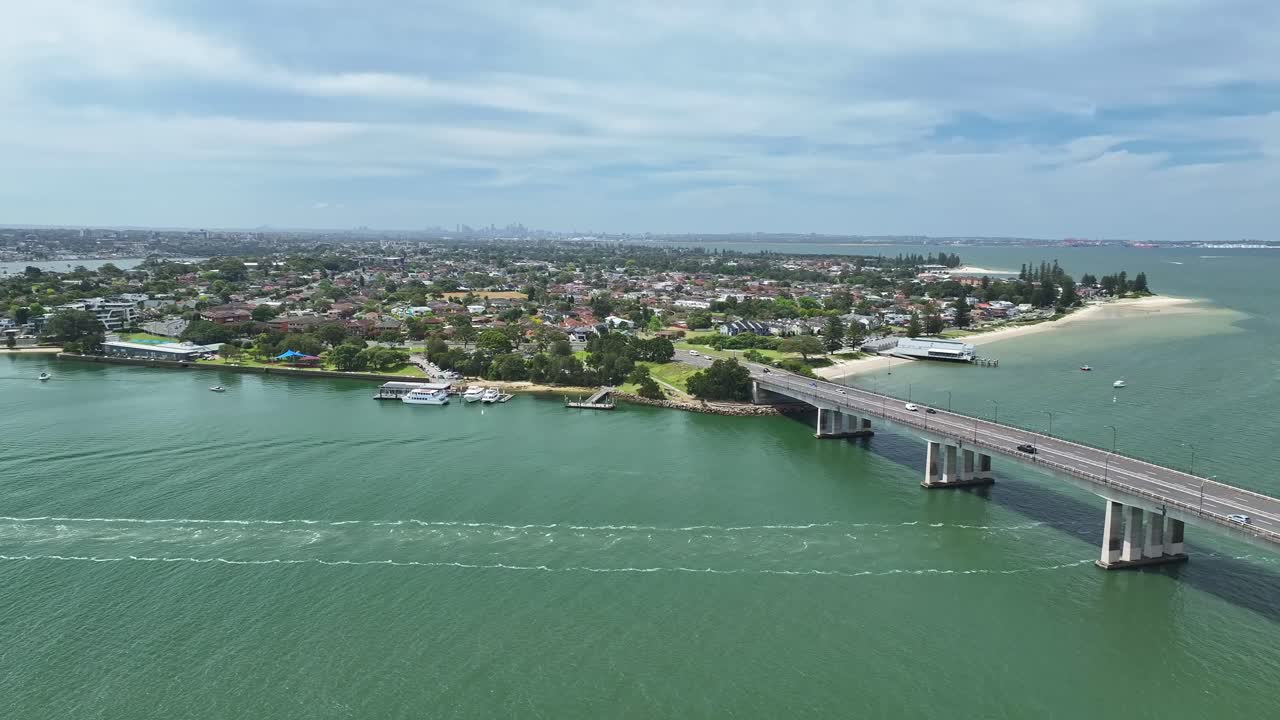 Aerial View of a Bridge Over Water in a Coastal City