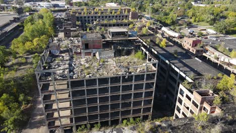 abandoned multi story building complex in detroit, aerial drone view