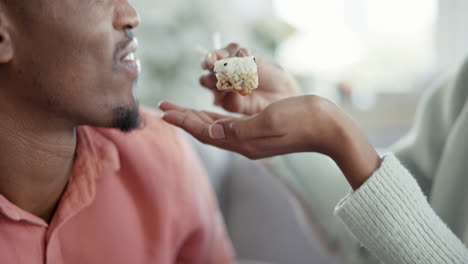 Hand,-sushi-and-feeding-a-black-man-with-a-couple