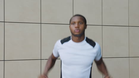 Young-Black-Man-Warming-Up-Before-Running-Outdoors