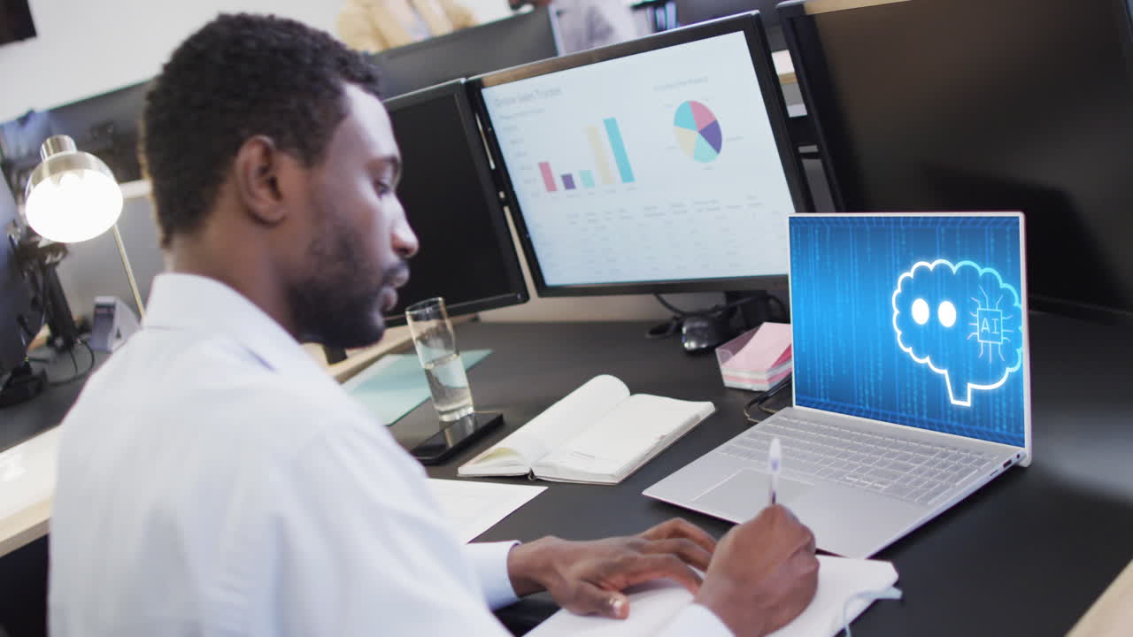Composition of african american businessman using laptop with ai chat on screen