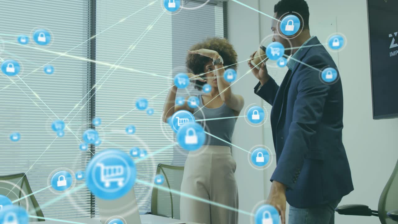 Team collaborating at table, pointing to laptop and initiating AR cart and lock icons business demo