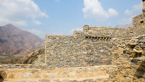 antique stone house architecture in saudi arabia town known as thee ain, exterior facade view