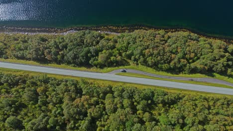 aerial over road near syvdefjorden in the vanylven municipality, norway