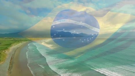 digital composition of waving brazil flag against aerial view of beach and sea waves