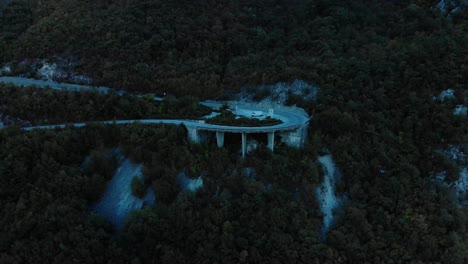 aerial medium shot of mountain road after sunset-4