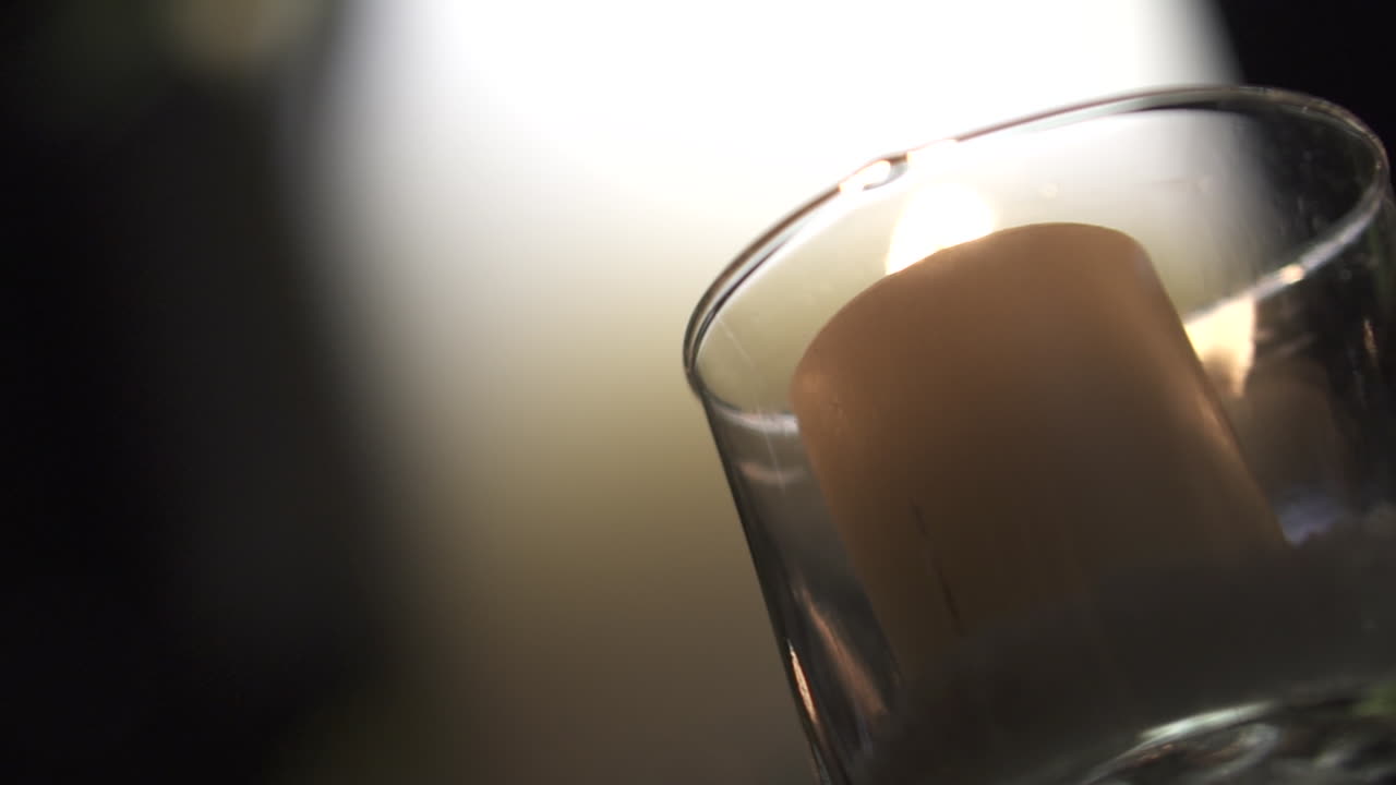 Candlelit decor in a dark room with soft light creating a warm and romantic atmosphere