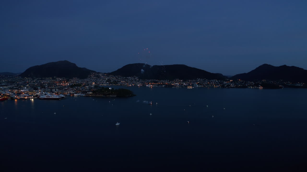 Aerial shot of fireworks over the bay in Bergen, Norway on the constitution day May 17