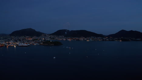 aerial shot of fireworks over the bay in bergen, norway on the constitution day may 17