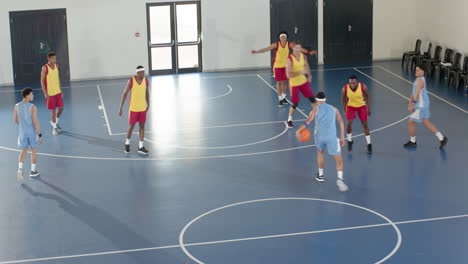 basketball players competing intensely on indoor court during practice game