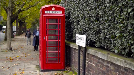 red telephone booth in a london street