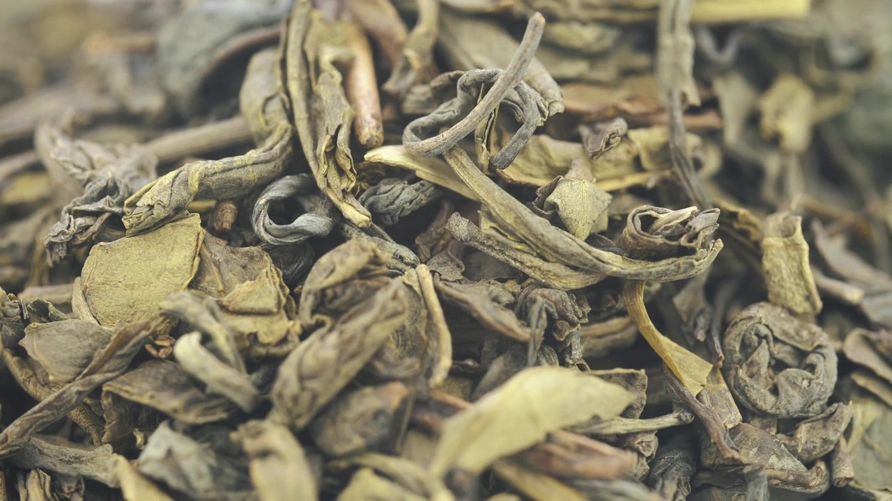 Close-up Macro Shot of Dried Green Tea Leaves