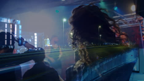 man wearing knit beanie merging night highway light trails with motion graphics for tech design