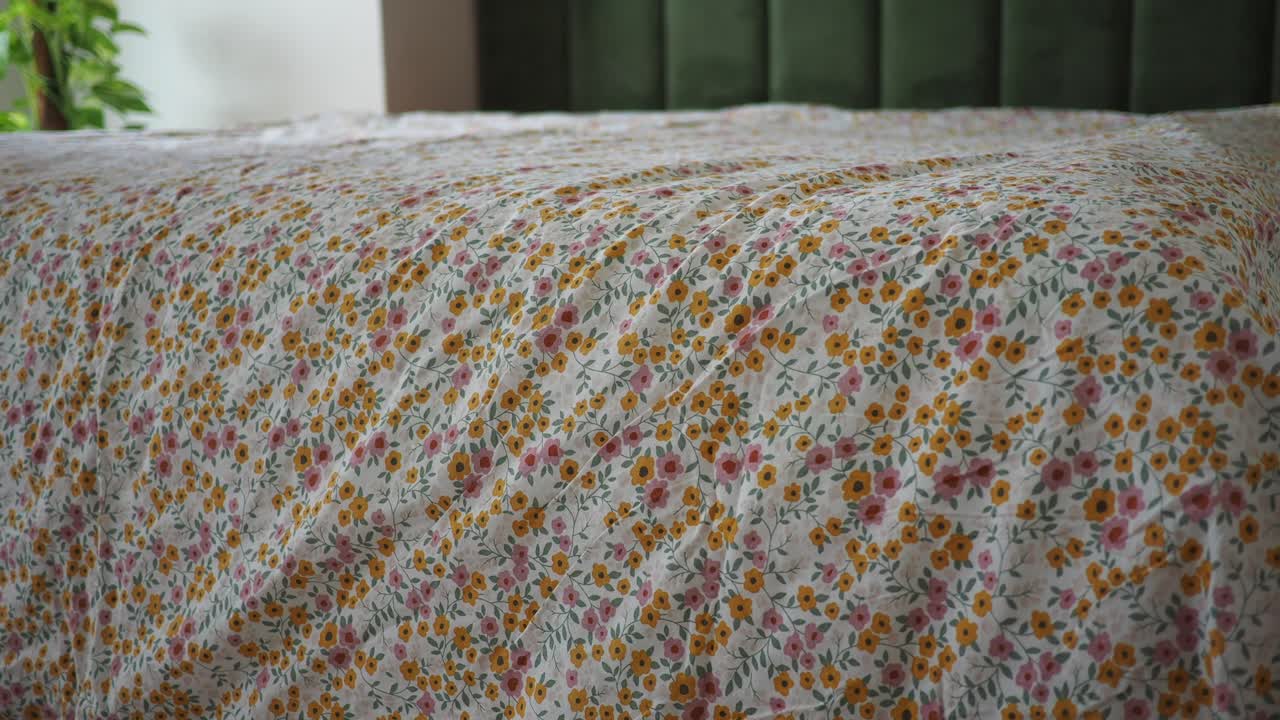 Bed with Floral Bedspread