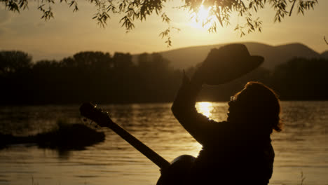 sunset musician by the river