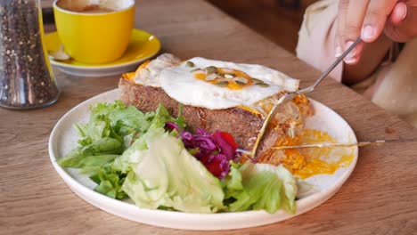 delicious breakfast with eggs, toast, and a side salad