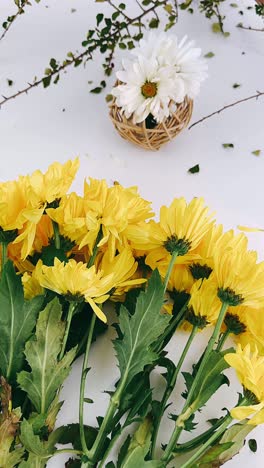 yellow and white flowers arrangement