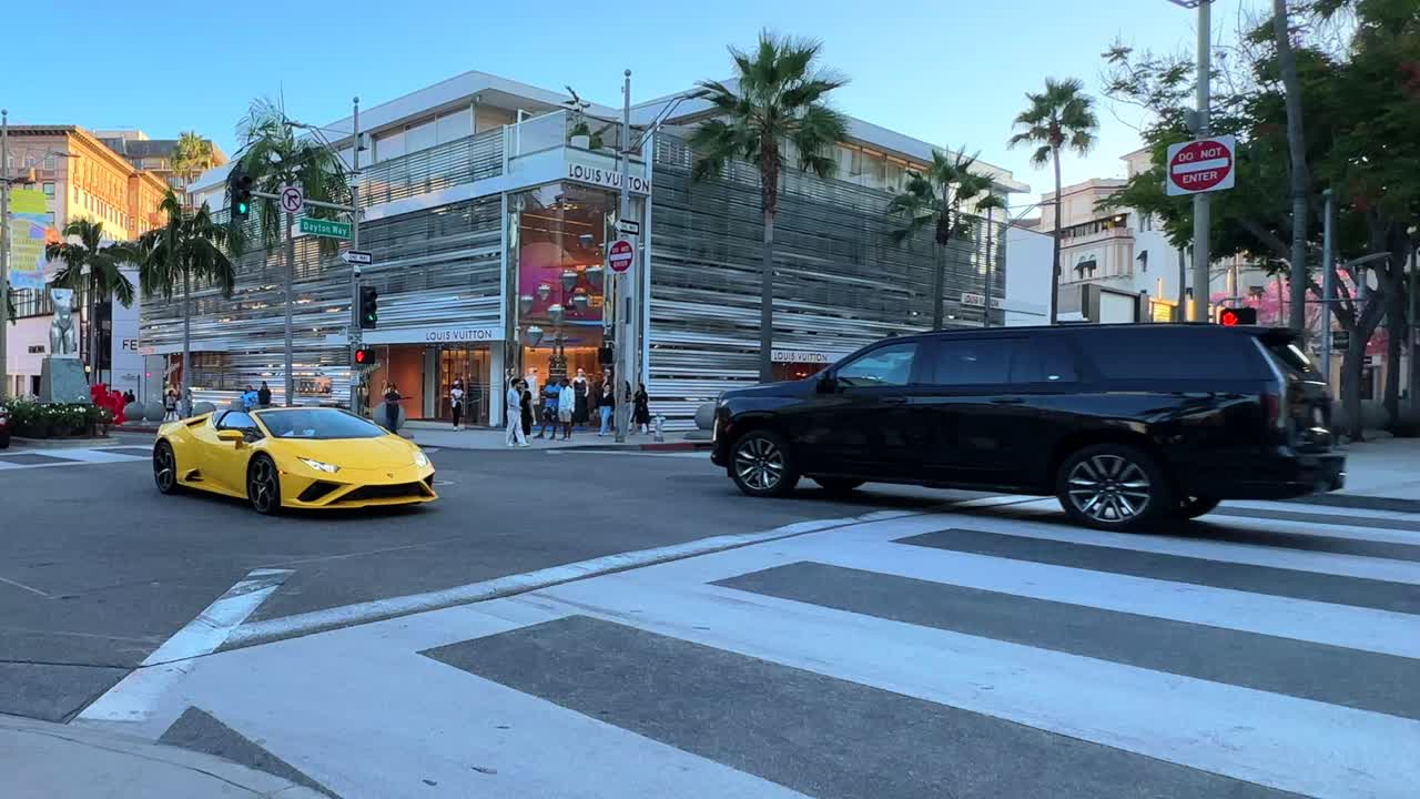 Lamborghini Sports Car Crossing Intersection At Rodeo Drive In Beverly Hills, Slow Motion Shot.