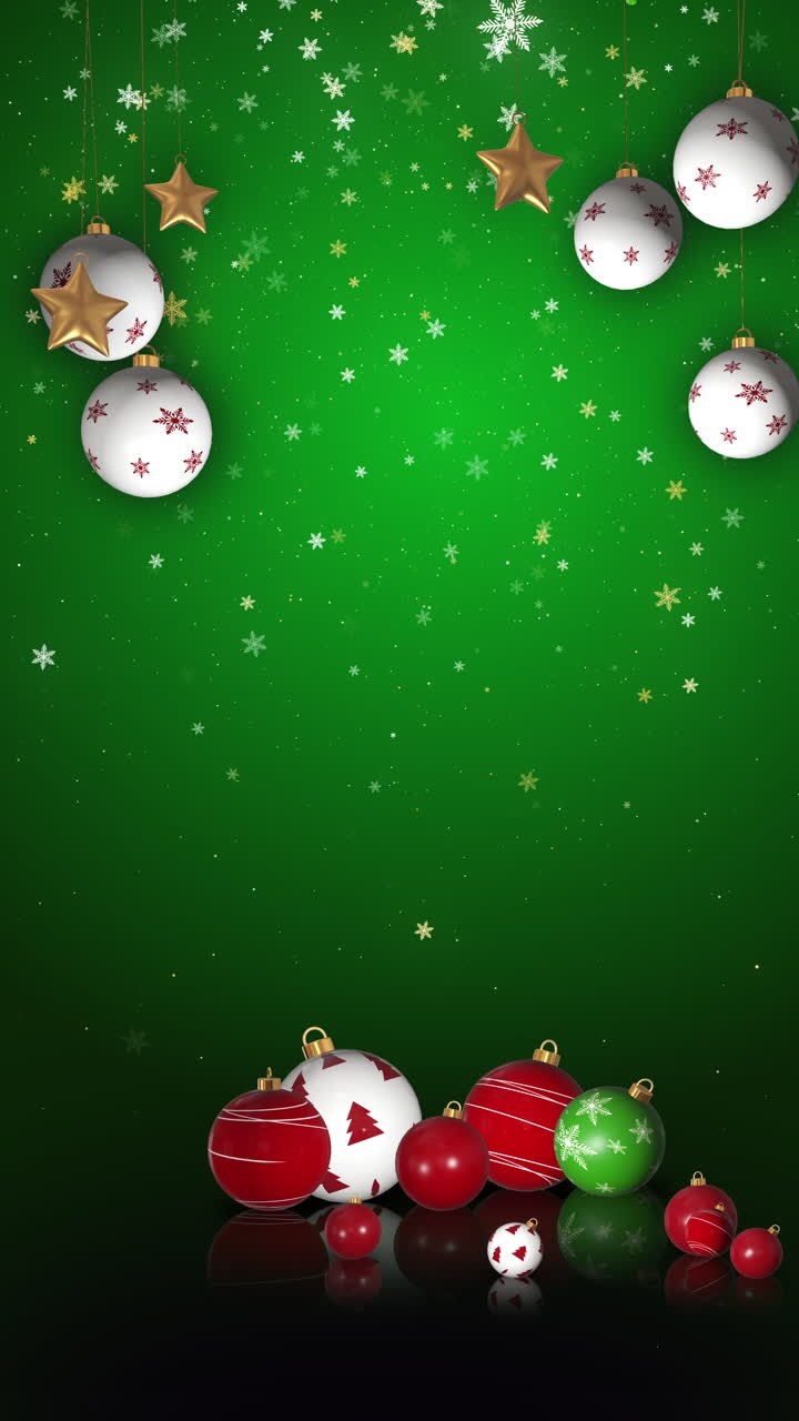 Christmas red and white balls on a green background. Animation with particles and snowflakes. Looped motion graphics. Vertical video.