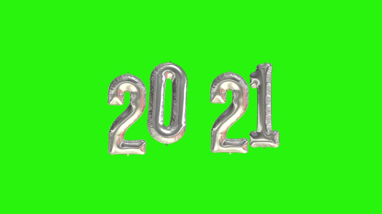 Neujahrsfeier 2021. Silberne Folienballons mit der Zahl 2021 auf grünem Hintergrund.