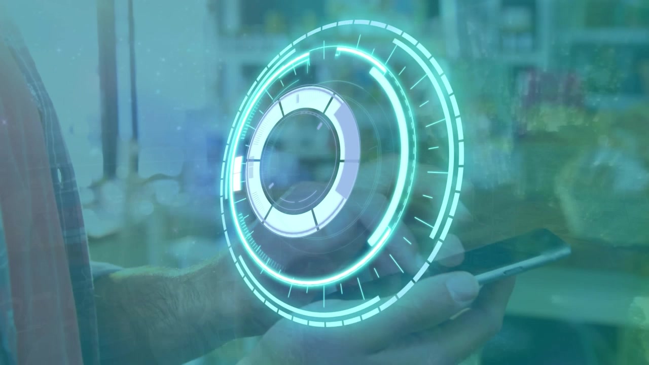 Animation of processing circle over hands of caucasian man using smartphone