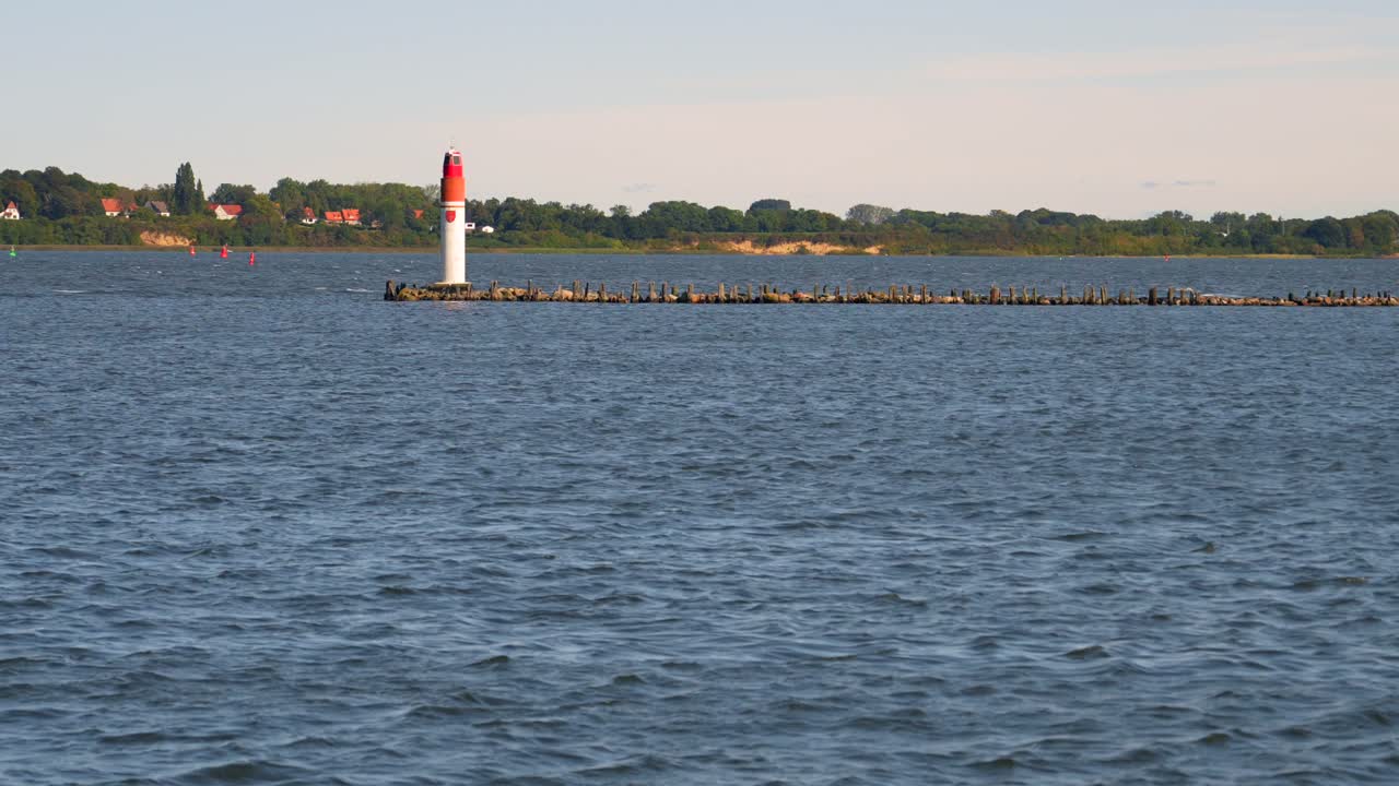 pier light at port of stralsund surrounded by water