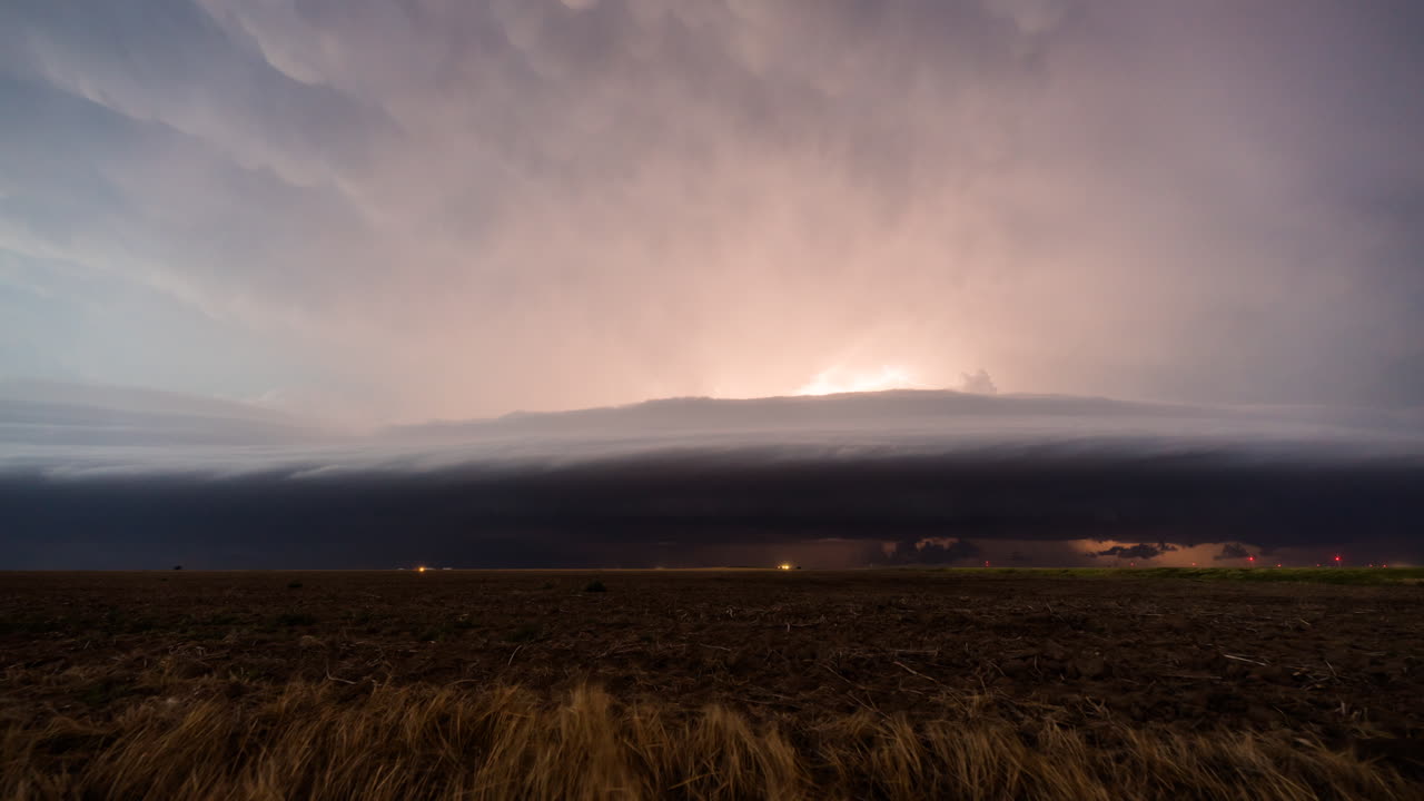 Lightning flickering through approaching storm clouds time lapse