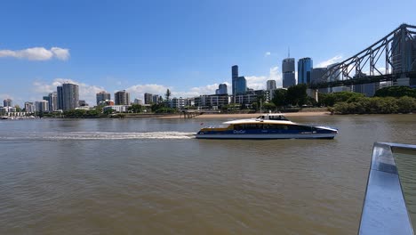 citycat ferry passing by kangaroo point and story bridge on brisbane river