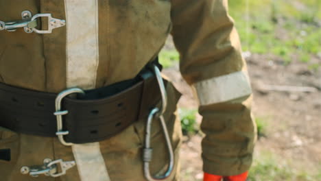 firefighter preparing fire extinguisher