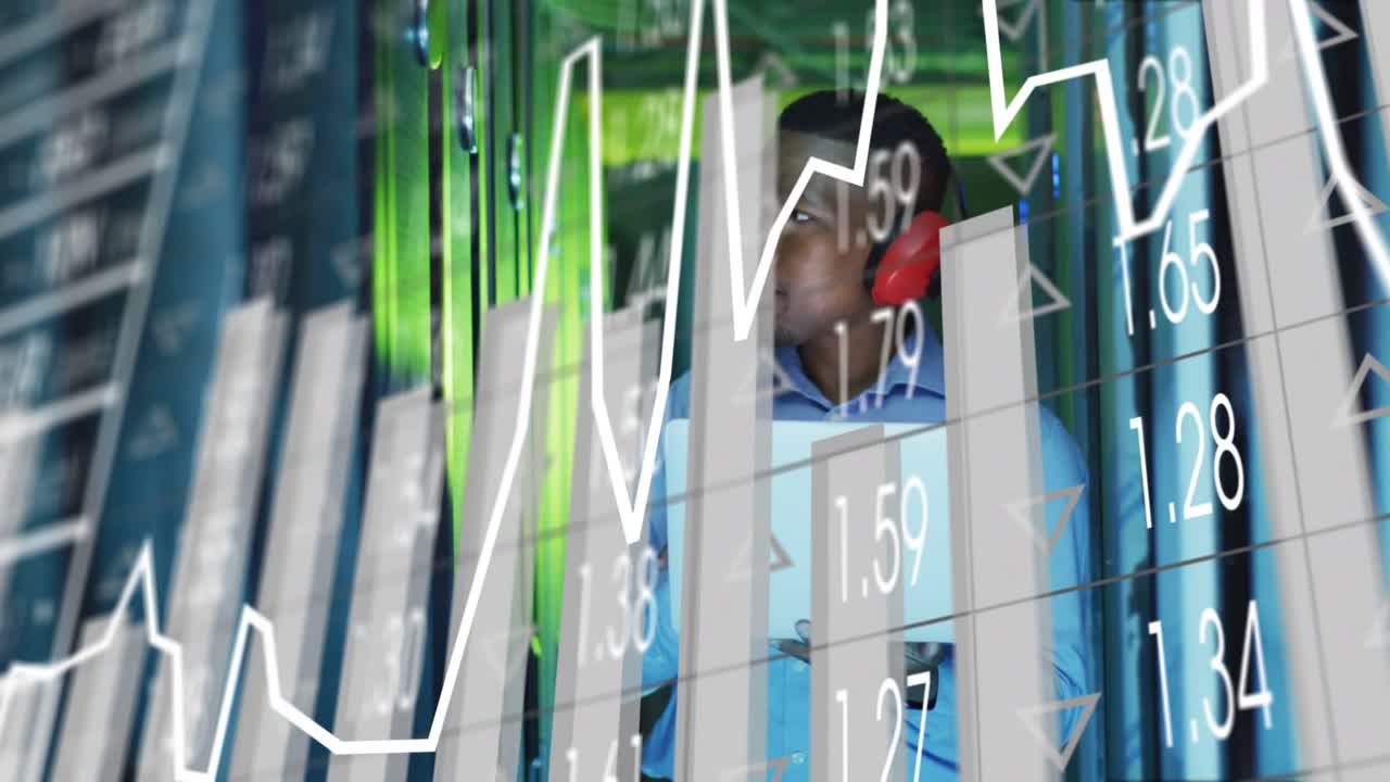 Data center tech scanning tablet and checking server racks while reacting to animated metric spikes