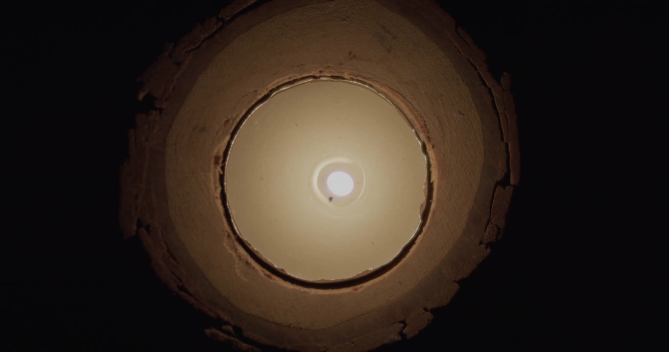 Top down of a candle being blown out