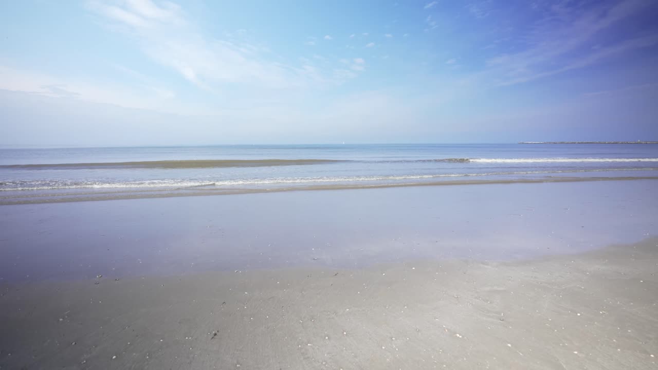 Sea waves reaching the beach, approach shot