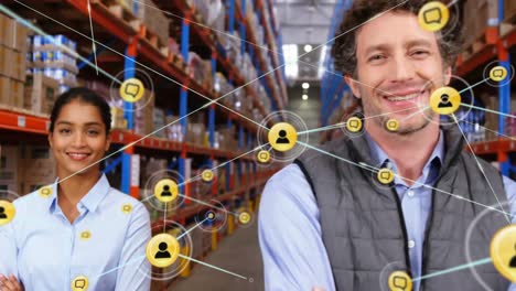 animation of network of digital icons over team of diverse supervisors smiling at warehouse