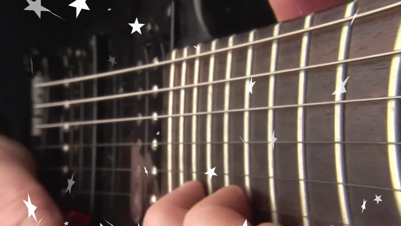 Opening focusing on steel guitar, guitarist practicing picking low E string sliding, stars drifting