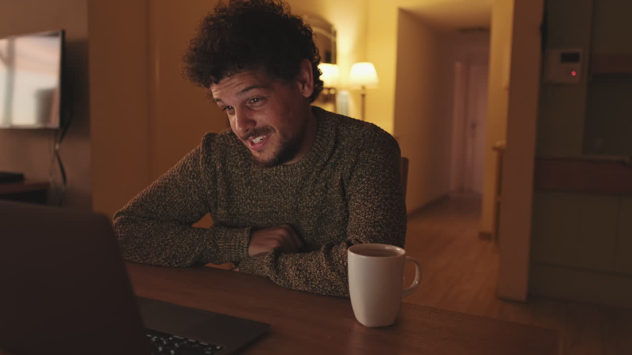 Man on video call at home