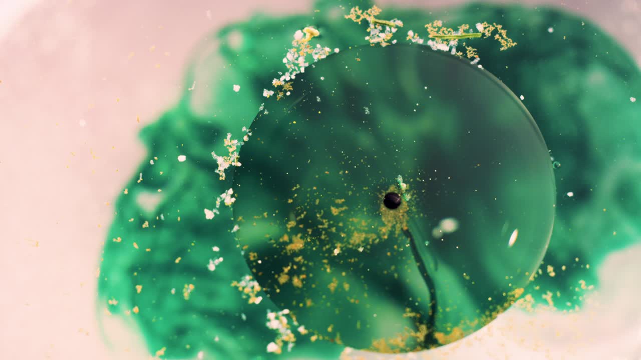 추상적인 녹색 잉크 액체 떠다니는 오브 배경 텍스처